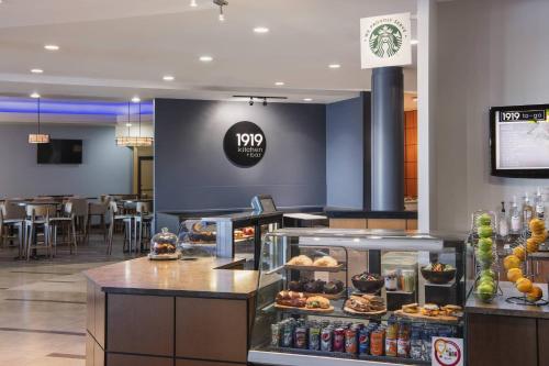 a restaurant with a bakery with pastries on display at Delta Hotels by Marriott Regina in Regina