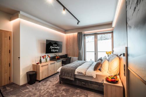 Postel nebo postele na pokoji v ubytování Wellness Apartmány Viktória