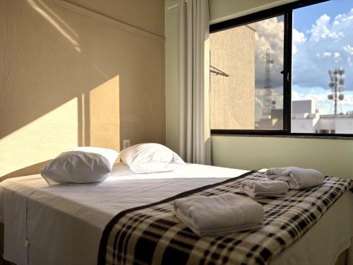 Postel nebo postele na pokoji v ubytování Vista Hotel