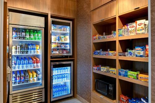 a refrigerator filled with lots of drinks and food at Fairfield Inn & Suites by Marriott Selinsgrove in Selinsgrove
