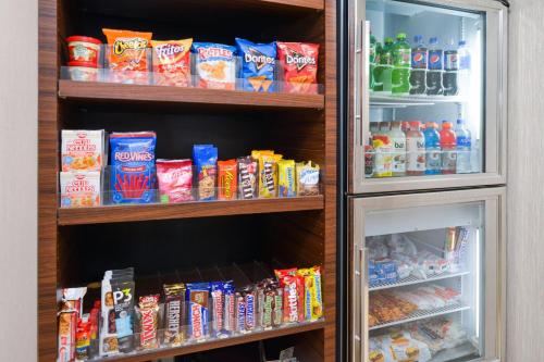 a refrigerator filled with lots of food and drinks at Fairfield Inn Salt Lake City Layton in Layton