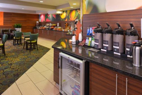a bar with bottles of wine on a counter at Fairfield Inn Salt Lake City Layton in Layton