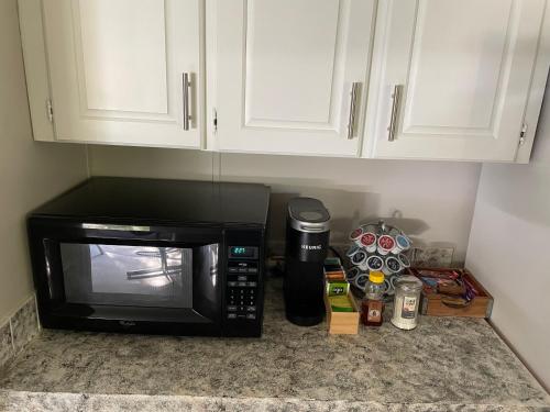 a microwave sitting on top of a kitchen counter at ChassRiverVibes in Homosassa