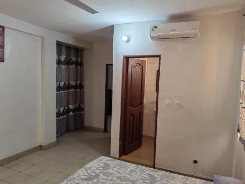 Postel nebo postele na pokoji v ubytování Tadagbe Appart Studio2