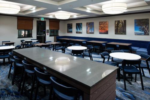 a large room with tables and chairs in it at Fairfield Inn & Suites Santa Cruz - Capitola in Capitola