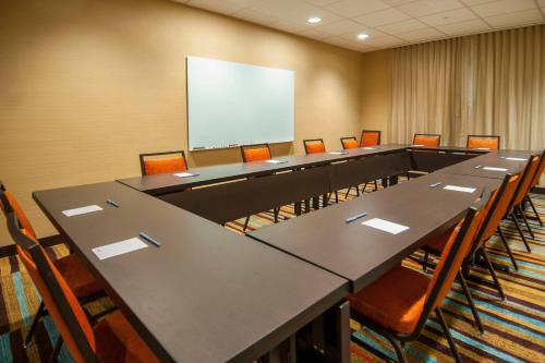 a conference room with a long table and chairs at Fairfield Inn & Suites by Marriott LaPlace in Laplace