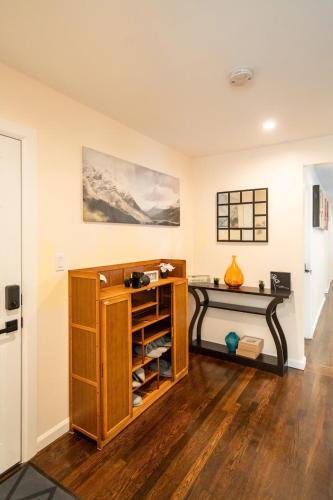 a room with a wooden book shelf in a room at 30-1 - 4BR Boston - Cozy Apt near Geneva Cliffs in Boston