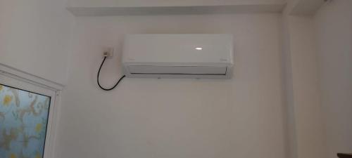a white light on a white wall in a room at Villa Sasindu in Koggala