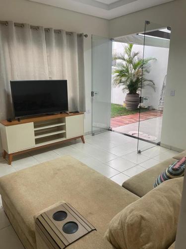 a living room with a flat screen tv and a couch at Casa Sinop in Sinop
