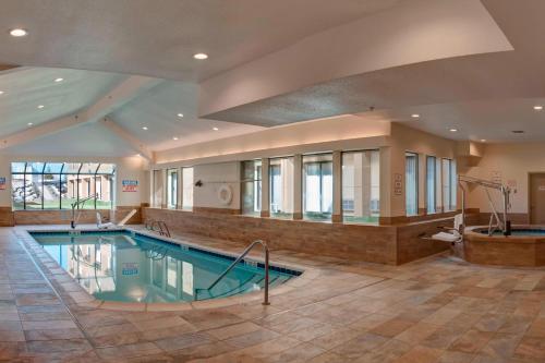 a large swimming pool in a large building with a pool at Fairfield Inn & Suites by Marriott Spokane Valley in Spokane Valley
