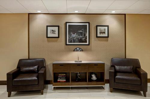 two chairs and a table in a waiting room at Four Points by Sheraton Peoria in Peoria