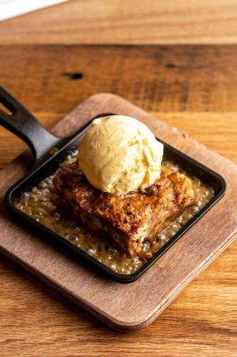 a plate of food with a scoop of ice cream on top at Four Points by Sheraton Peoria in Peoria