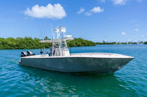 a boat sitting in the water on a body of water at Fairfield by Marriott Inn & Suites Marathon Florida Keys in Marathon