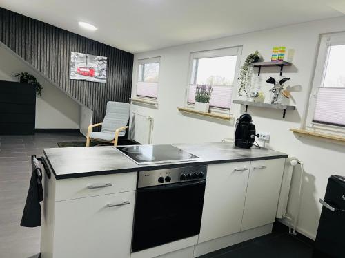 a kitchen with a sink and a stove top oven at Apartment in Erftstadt , Phantasialand Brühl bei Cologne, Zentral, Bahnhof nah in Erftstadt