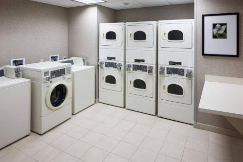a laundry room with four washer and dryers at Fairfield Inn and Suites Phoenix Chandler Fashion Center in Chandler