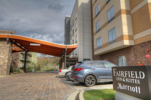 a car parked in a parking lot in front of a building at Fairfield Inn & Suites by Marriott Gatlinburg Downtown in Gatlinburg