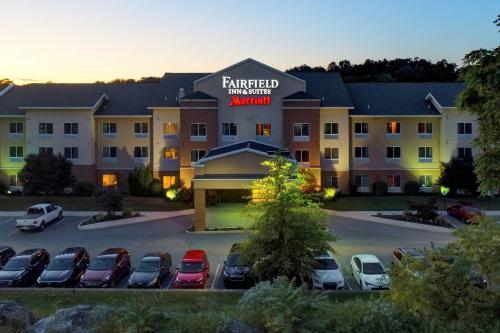 a hotel with cars parked in a parking lot at Fairfield Inn & Suites by Marriott Harrisburg West/New Cumberland in New Cumberland