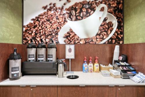 a counter with a coffee maker and a picture of coffee beans at Fairfield Inn & Suites by Marriott Harrisburg West/New Cumberland in New Cumberland