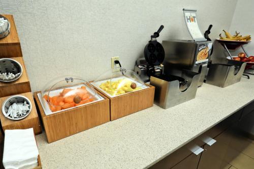 a kitchen counter with two bins of fruit on it at Fairfield Inn & Suites by Marriott Harrisburg West/New Cumberland in New Cumberland