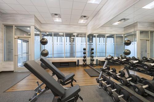 a gym with treadmills and elliptical machines at Fairfield Inn and Suites by Marriott St Louis Downtown in Saint Louis
