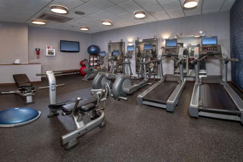 a gym with several treadmills and machines at Four Points Philadelphia City Center in Philadelphia