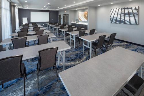 a classroom with tables and chairs in a room at Fairfield Inn & Suites by Marriott Oklahoma City Downtown in Oklahoma City