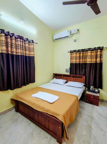 Katil atau katil-katil dalam bilik di Gokarna Thayi Krupa Homestay