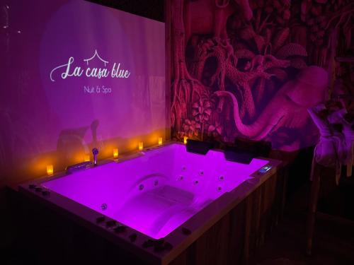 a purple bath tub with lights in a room at SPA La Casa Blue in Wingles