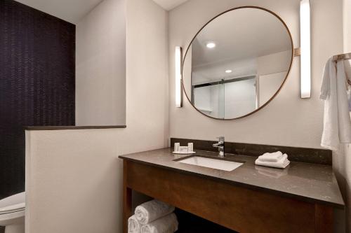 a bathroom with a sink and a mirror at Fairfield by Marriott Inn & Suites St. Paul Eagan in Eagan