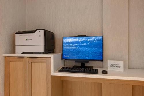 a computer monitor and a printer on a desk at Fairfield by Marriott Inn & Suites St. Paul Eagan in Eagan