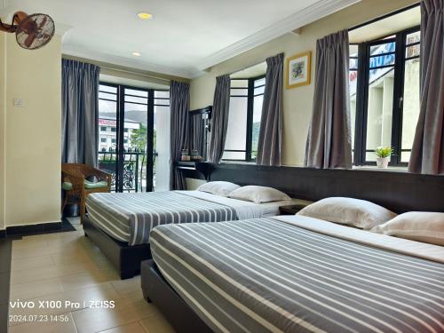 Postel nebo postele na pokoji v ubytování Hong Kong Hotel