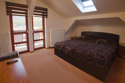 Postel nebo postele na pokoji v ubytování Vila Alexandros