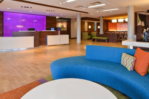 a blue couch in the lobby of a hospital at Fairfield Inn & Suites by Marriott Gallup in Gallup