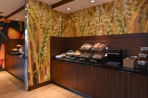 a bakery with a counter with pastries on it at Fairfield Inn & Suites by Marriott Gallup in Gallup