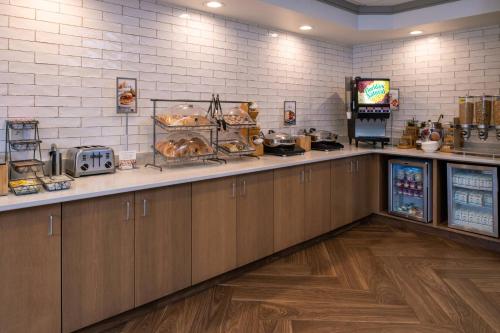 a kitchen with a counter with food on it at Fairfield Inn & Suites High Point Archdale in Archdale