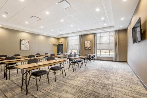 a classroom with tables and chairs in a room at Four Points by Sheraton Elkhart in Elkhart