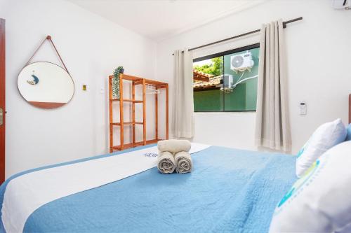 Arpoador Apts Praia & Piscina - Buzios Rentalsにあるベッド