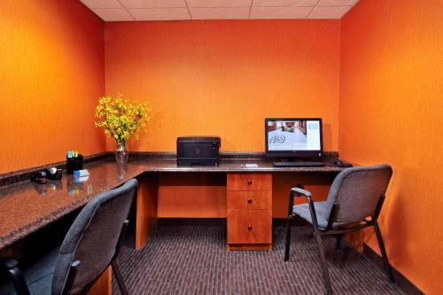 an office with a desk with a laptop computer on it at Fairfield Inn & Suites by Marriott Fairfield Napa Valley Area in Fairfield