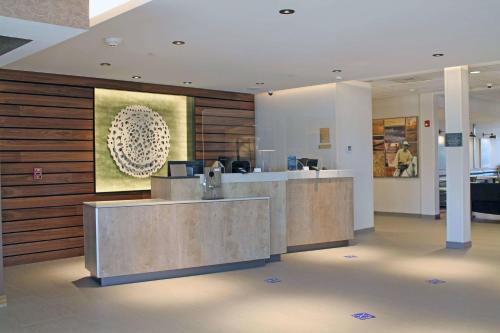 a lobby with a reception desk in a building at Fairfield by Marriott Inn & Suites St Louis South in Saint Louis