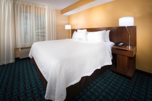a large white bed in a hotel room at Fairfield Inn & Suites Idaho Falls in Idaho Falls