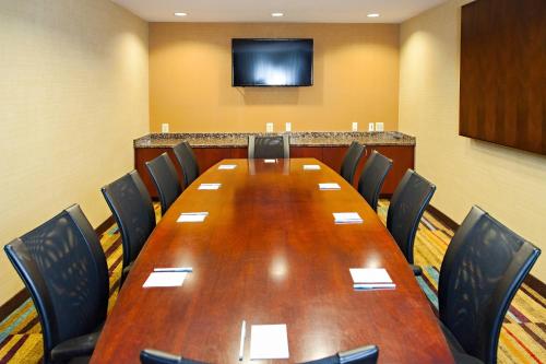 a conference room with a large wooden table and chairs at Fairfield Inn & Suites by Marriott Somerset in Somerset