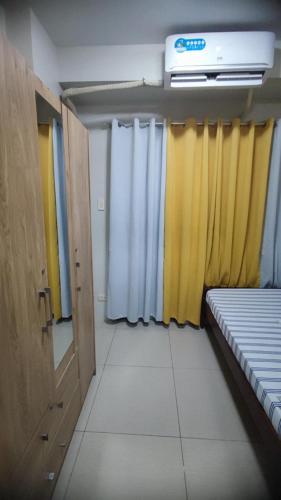 Кровать или кровати в номере Shell Residences