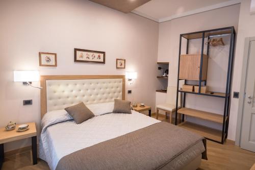 Postel nebo postele na pokoji v ubytování Brunelli B&B