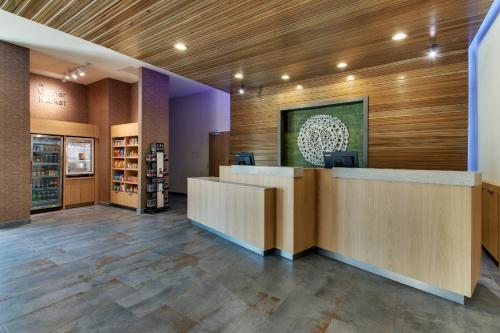 a lobby of a store with a reception desk at Fairfield Inn and Suites by Marriott Houston Brookhollow in Houston
