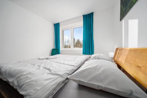 Ein Bett oder Betten in einem Zimmer der Unterkunft Apartmány Rezidence Lyžařská