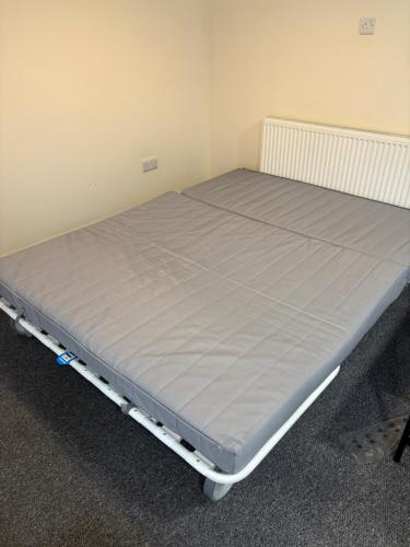a bed in a room with a mattress at Jubilee Works in Chesterfield