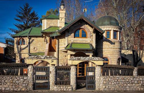 a house with a fence in front of it at Royal Casa in Belgrade