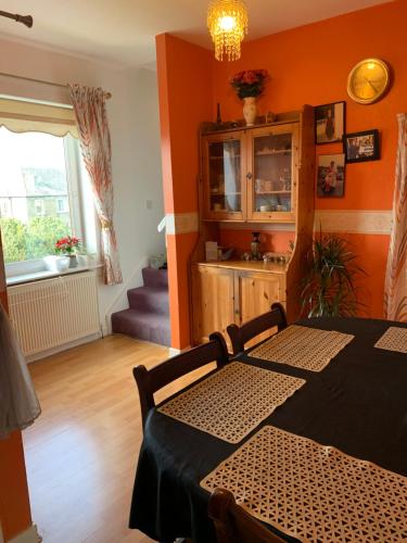 a dining room with a table and a window at Little Universe in Edinburgh