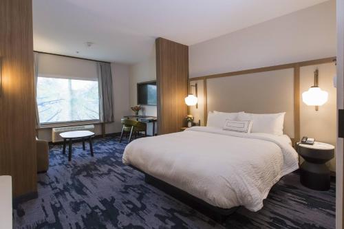 a hotel room with a large bed and a window at Fairfield Inn & Suites by Marriott Philadelphia Valley Forge/Great Valley in Berwyn