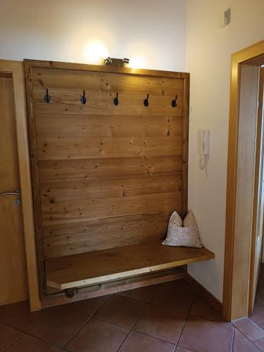 a wooden wall with a bench in a room at Haus Angelika im Zillertal in Hippach